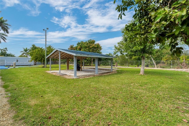 view of community with a gazebo, a patio area, and a lawn