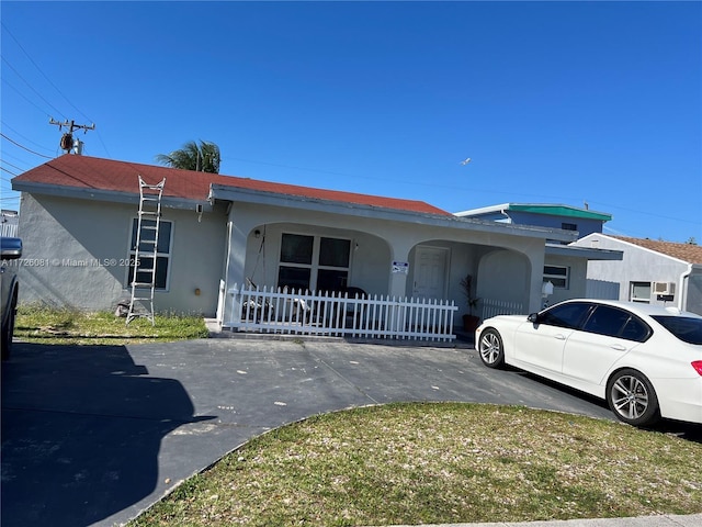 720 NW 30th Ave, Miami, FL 33125 - ranch-style house featuring a porch