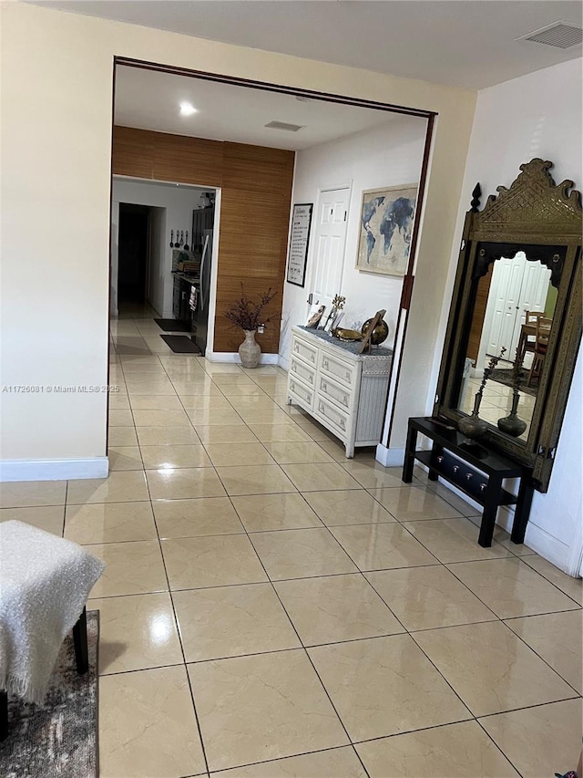 hallway with light tile patterned floors