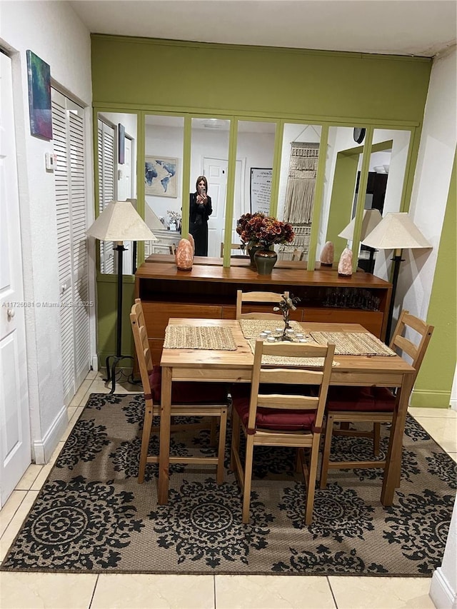 dining space with tile patterned floors