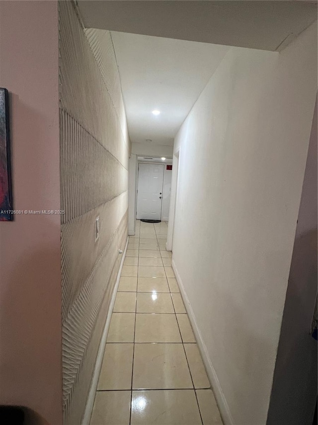 hallway featuring light tile patterned floors