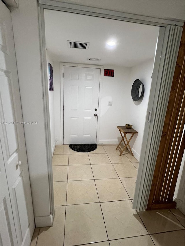 hallway with light tile patterned floors