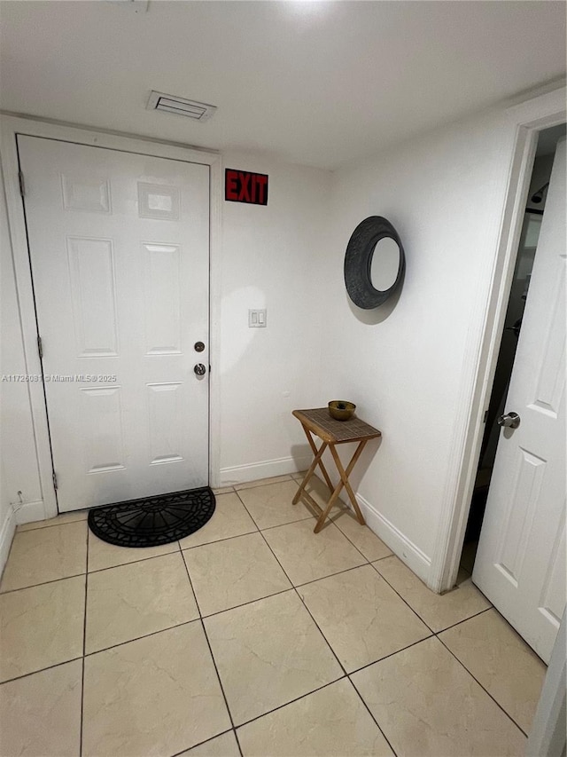 interior space with light tile patterned floors