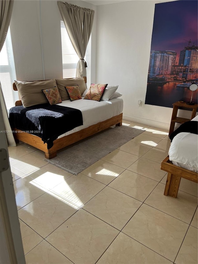 bedroom featuring light tile patterned floors