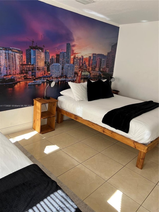 bedroom featuring tile patterned flooring