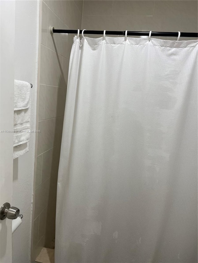 bathroom with a shower with shower curtain