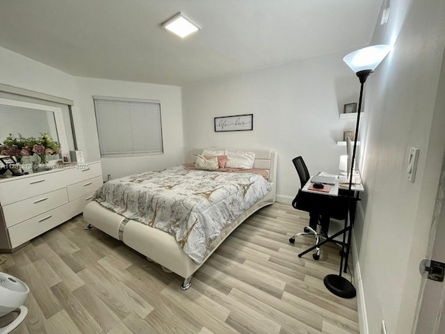 bedroom with light hardwood / wood-style floors