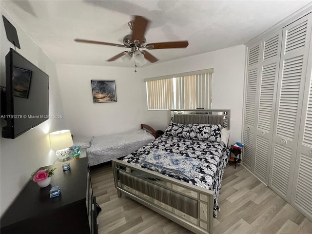 bedroom featuring a closet, ceiling fan, and light wood-type flooring