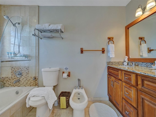 bathroom featuring a bidet, vanity, tile patterned flooring, and tiled shower / bath combo