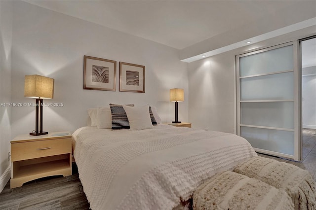 bedroom featuring dark hardwood / wood-style floors