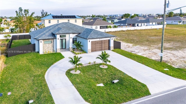 view of front facade featuring a garage and a front yard