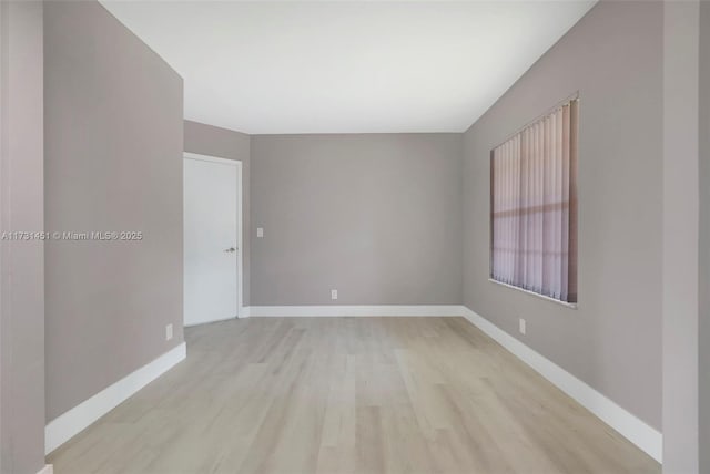 spare room featuring light hardwood / wood-style floors