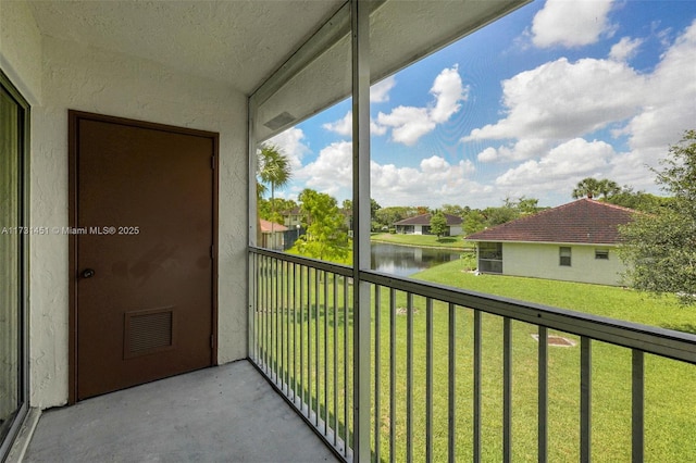 balcony featuring a water view