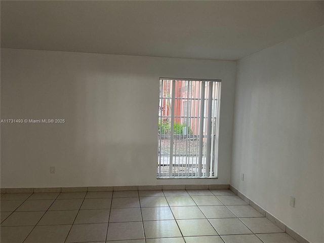 10744 N Kendall Dr Unit M11, Miami, FL 33176 - spare room with light tile patterned floors and baseboards