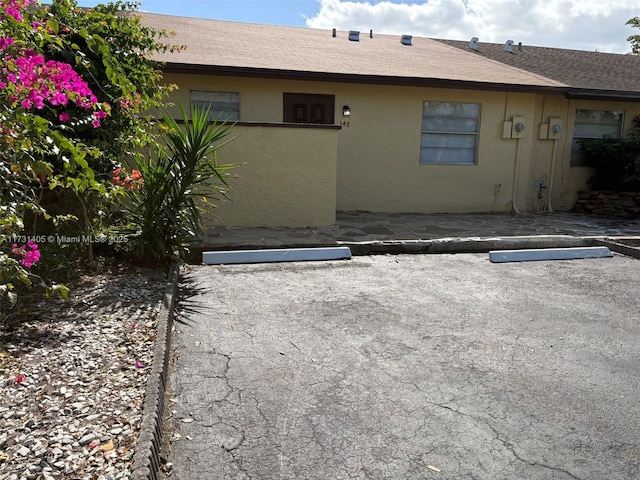 back of property with a patio