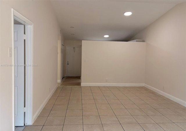 spare room featuring light tile patterned floors