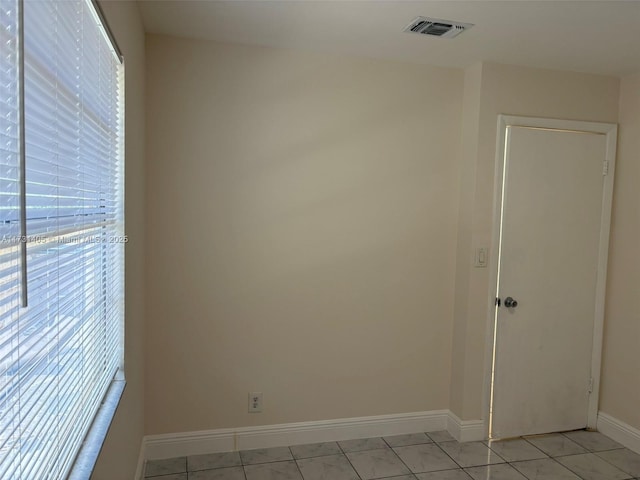 view of tiled spare room