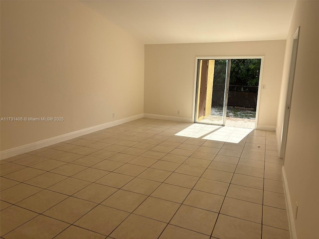 empty room featuring light tile patterned floors