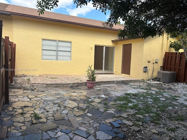 back of house with cooling unit and a patio area