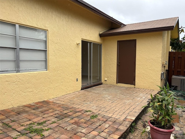 exterior space featuring central AC unit and a patio