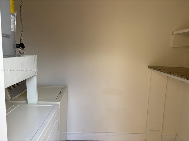 clothes washing area featuring independent washer and dryer