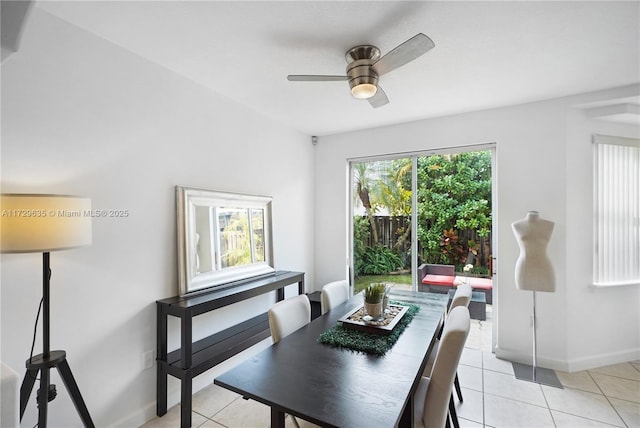 tiled dining room featuring ceiling fan