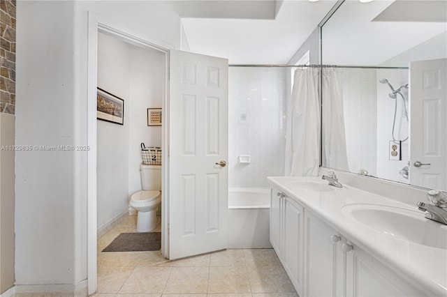 full bathroom featuring shower / bath combination with curtain, tile patterned floors, toilet, and vanity