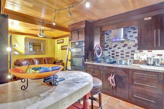 kitchen featuring wood ceiling, black double oven, decorative backsplash, and light tile patterned floors