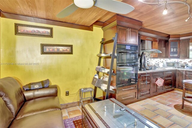 living room with wood ceiling and ceiling fan