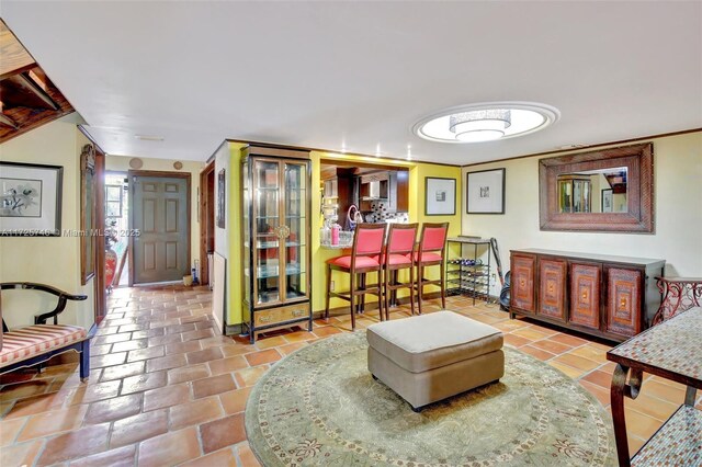 living room with tile patterned floors