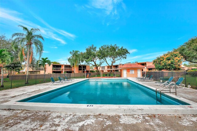 view of swimming pool with a patio