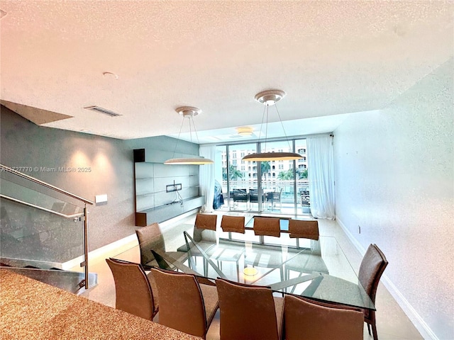 dining space with a textured ceiling