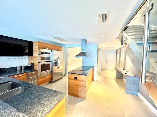 kitchen featuring light tile patterned flooring, appliances with stainless steel finishes, sink, and island range hood