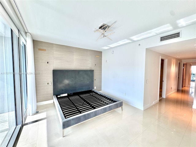 unfurnished bedroom featuring light tile patterned floors