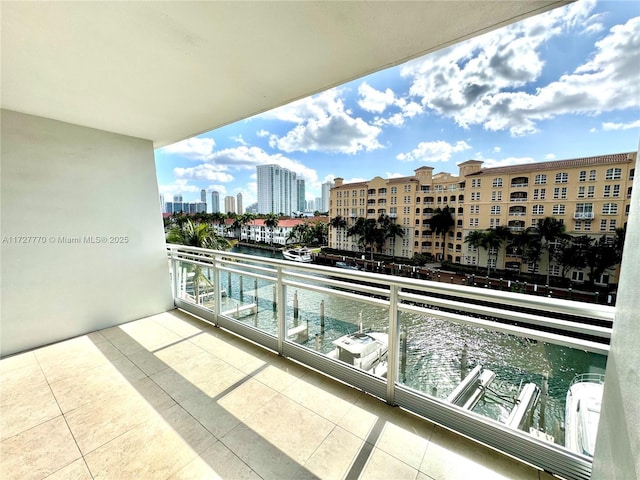 balcony featuring a water view