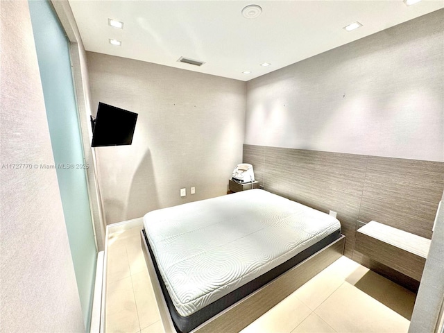 bedroom featuring light tile patterned floors