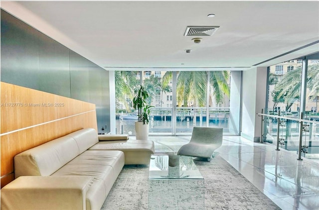 living room featuring floor to ceiling windows