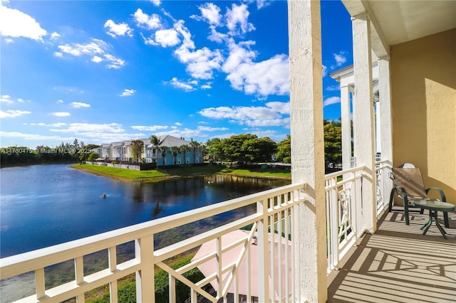 balcony featuring a water view