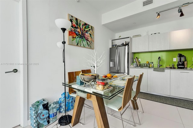 tiled dining space with sink