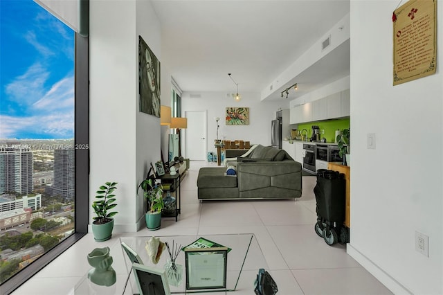 living room with light tile patterned floors