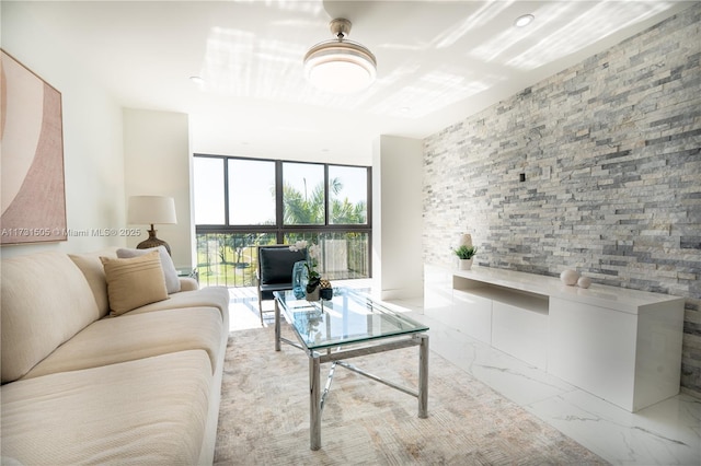 living room featuring a wall of windows