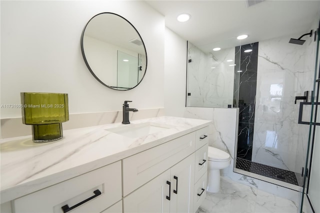 bathroom featuring vanity, walk in shower, and toilet