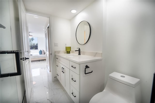 bathroom with vanity and toilet