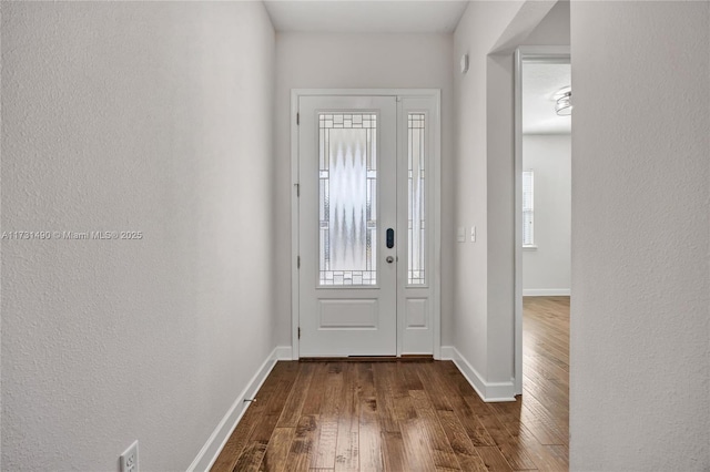 entrance foyer with dark hardwood / wood-style floors