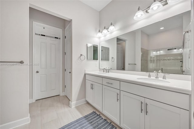 bathroom featuring vanity and a shower with shower door