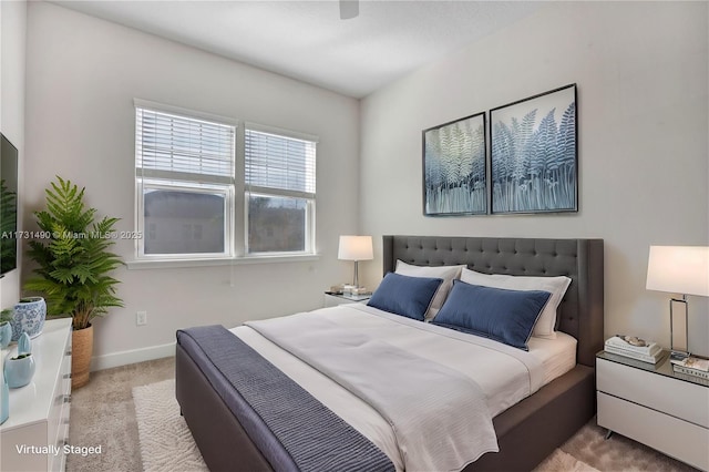 carpeted bedroom featuring ceiling fan