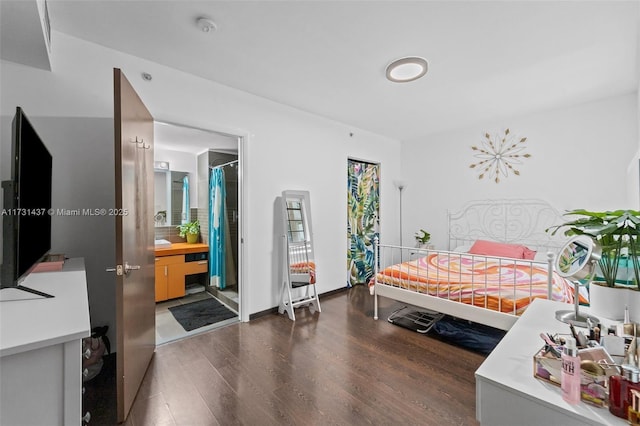 bedroom with dark wood-type flooring