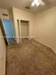 unfurnished bedroom featuring a closet and ceiling fan