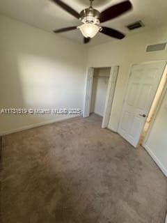 unfurnished bedroom with ceiling fan and carpet flooring