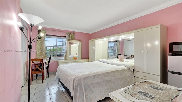 tiled bedroom with crown molding and stainless steel fridge